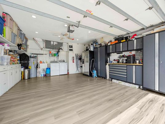 Interior, Kitchen, Recessed Lighting, Washer, Wood Texture Flooring
