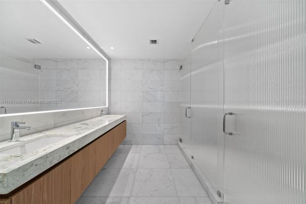 Bathroom, Dual Sink Vanities, Glass Shower, Interior, Marble, Marble Walls, Recessed Lighting