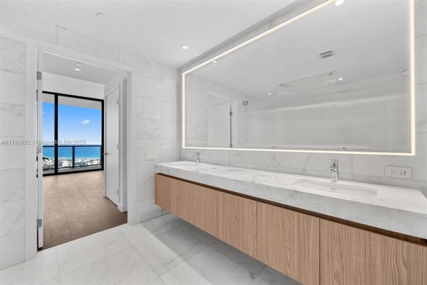 Bathroom, Dual Sink Vanities, Glass Shower, Interior, Marble, Marble Walls, Recessed Lighting, Water