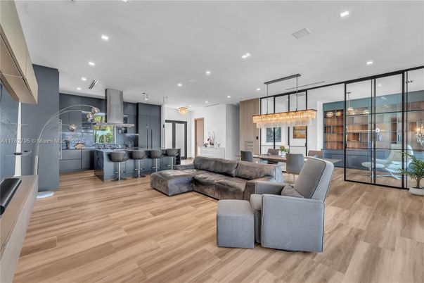 Chandelier, Dining room, Interior, Kitchen, Living room, Pendant Lights, Recessed Lighting, Stainless Steel Appliances, Wood Texture Flooring