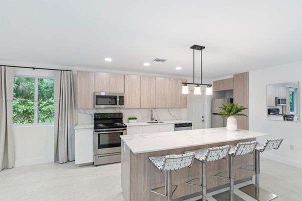 Interior, Kitchen, Marble, Marble Walls, Pendant Lights, Recessed Lighting, Stainless Steel Appliances