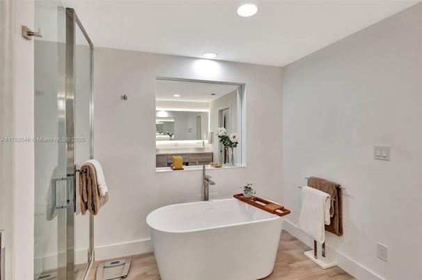 Bathroom, Free Standing Baths, Glass Shower, Interior, Recessed Lighting, Wood Texture Flooring