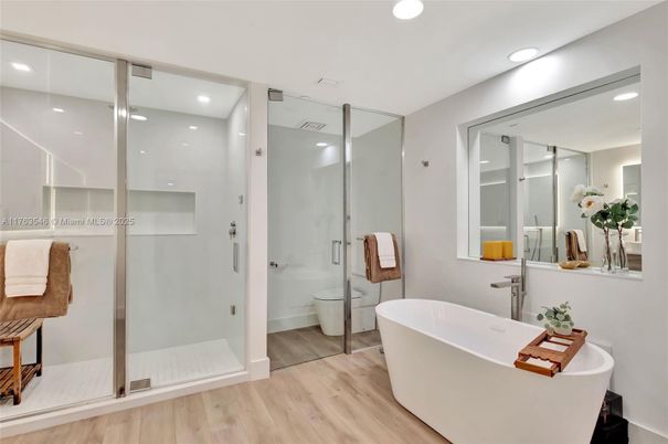 Bathroom, Free Standing Baths, Glass Shower, Interior, Recessed Lighting, Wood Texture Flooring