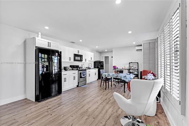 Dining room, Interior, Kitchen, Recessed Lighting, Stainless Steel Appliances, Wood Texture Flooring