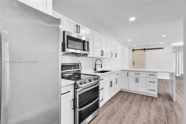 Interior, Kitchen, Recessed Lighting, Stainless Steel Appliances, Wood Texture Flooring