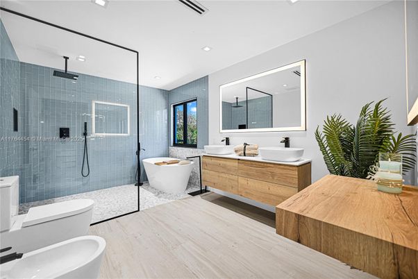 Bathroom, Dual Sink Vanities, Free Standing Baths, Glass Shower, Interior, Recessed Lighting, Wood Texture Flooring