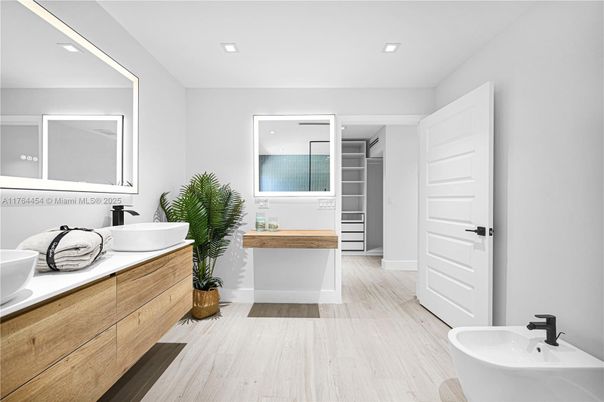 Bathroom, Dual Sink Vanities, Free Standing Baths, Interior, Recessed Lighting, Walk-in Closets, Wood Texture Flooring