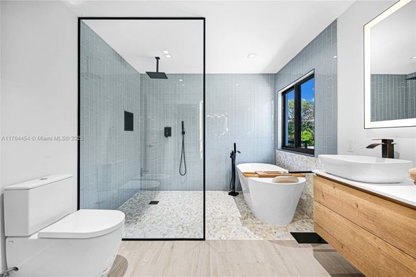Bathroom, Free Standing Baths, Glass Shower, Interior, Recessed Lighting, Wood Texture Flooring