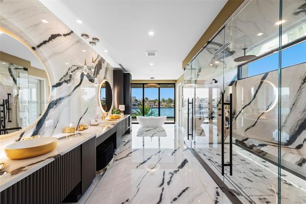 Bathroom, Dual Sink Vanities, Glass Shower, Interior, Marble, Marble Walls, Recessed Lighting, Water