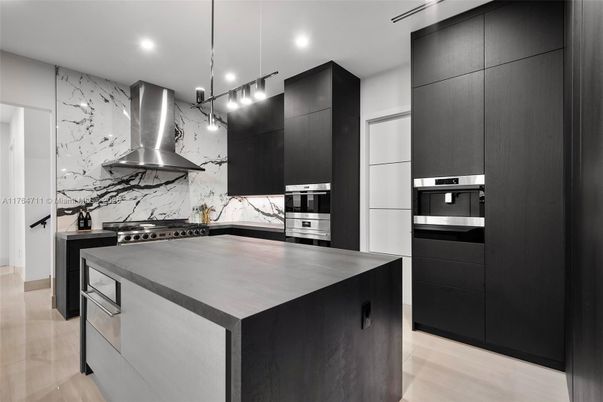 Interior, Kitchen, Marble Walls, Pendant Lights, Recessed Lighting, Stainless Steel Appliances, Wood Texture Flooring