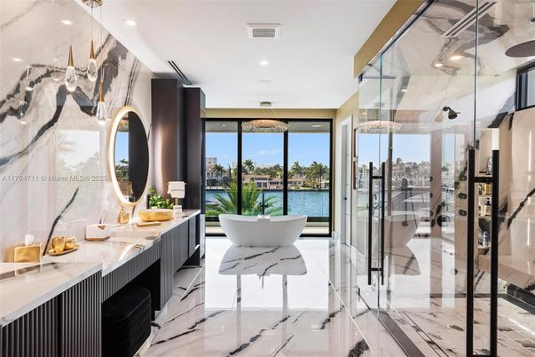 Bathroom, Free Standing Baths, Glass Shower, Interior, Marble, Marble Walls, Recessed Lighting, Water