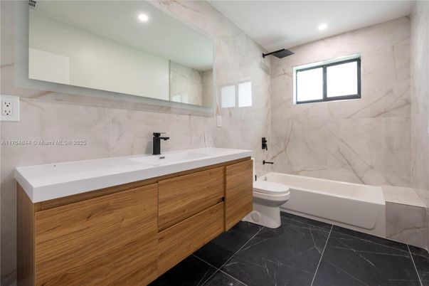 Bathroom, Dual Sink Vanities, Interior, Marble, Marble Walls, Recessed Lighting