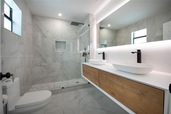 Bathroom, Dual Sink Vanities, Glass Shower, Interior, Marble, Marble Walls, Recessed Lighting
