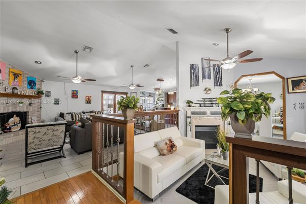 Dining room, Fireplace, Interior, Living room, Recessed Lighting, Wood Texture Flooring