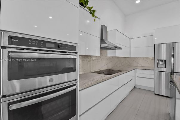 Interior, Kitchen, Marble Walls, Recessed Lighting, Stainless Steel Appliances