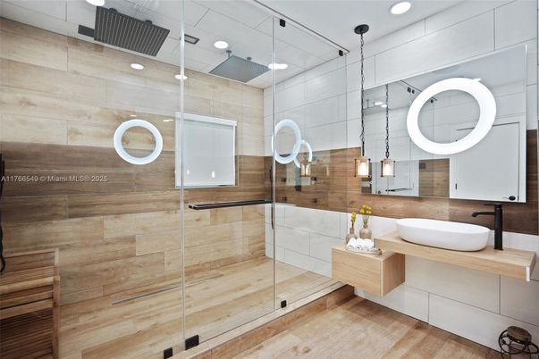 Bathroom, Dual Sink Vanities, Glass Shower, Interior, Pendant Lights, Recessed Lighting, Wood Texture Flooring, Wooden Walls