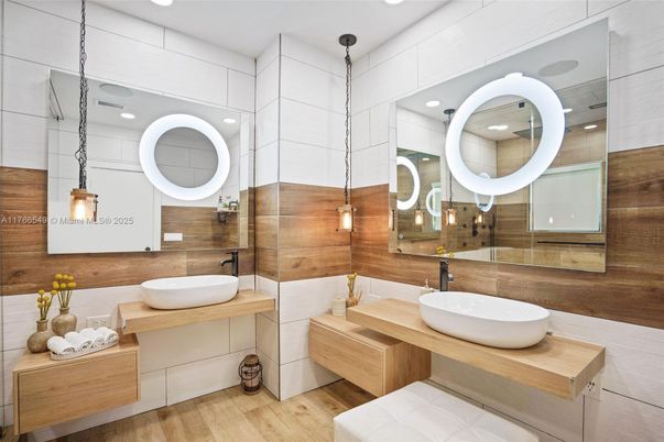 Bathroom, Dual Sink Vanities, Interior, Pendant Lights, Recessed Lighting, Wood Texture Flooring