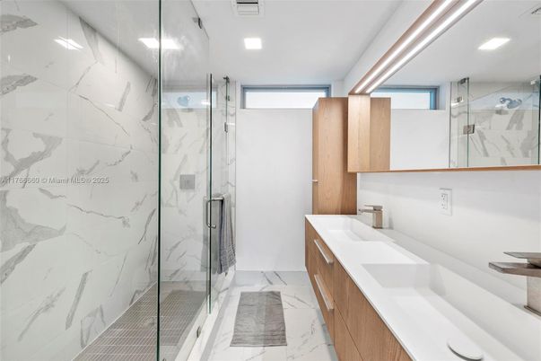 Bathroom, Dual Sink Vanities, Glass Shower, Interior, Marble, Marble Walls, Recessed Lighting