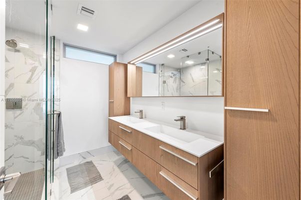 Bathroom, Dual Sink Vanities, Glass Shower, Interior, Marble, Marble Walls, Recessed Lighting