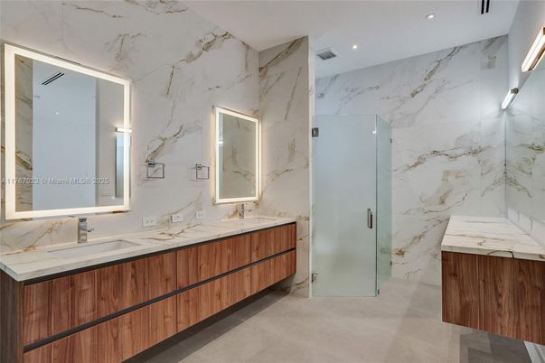 Bathroom, Dual Sink Vanities, Glass Shower, Interior, Marble Walls, Recessed Lighting