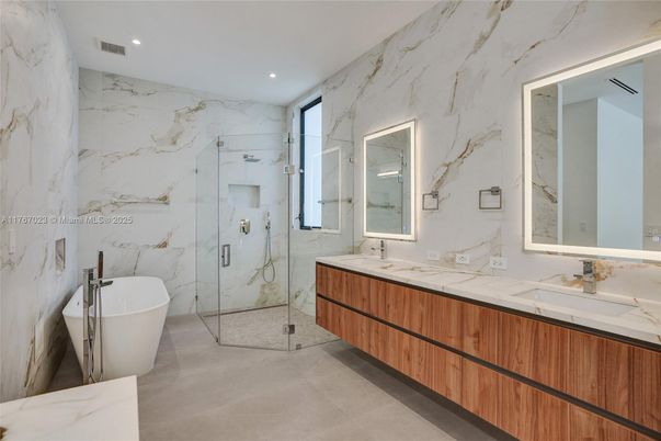 Bathroom, Dual Sink Vanities, Free Standing Baths, Glass Shower, Interior, Marble, Marble Walls, Recessed Lighting