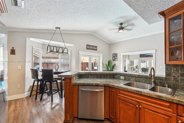 Dining room, Interior, Kitchen, Pendant Lights, Tile Countertops, Wood Texture Flooring