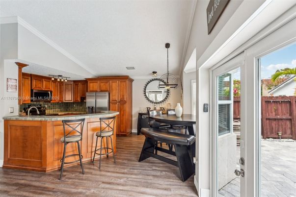 Dining room, Interior, Kitchen, Pendant Lights, Stainless Steel Appliances, Wood Texture Flooring