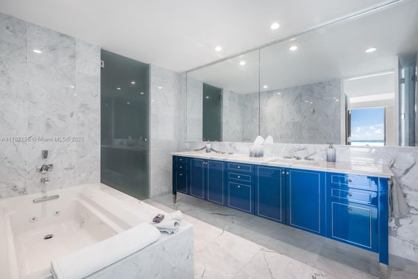 Bathroom, Dual Sink Vanities, Glass Shower, Interior, Marble, Marble Walls, Recessed Lighting