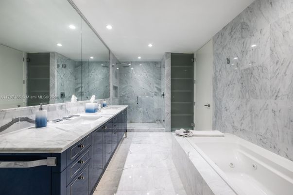 Bathroom, Dual Sink Vanities, Glass Shower, Interior, Marble, Marble Walls, Recessed Lighting