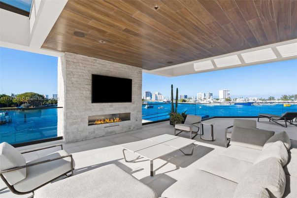 Exterior, Fireplace, Interior, Living room, Stone Walls, Water, Wooden Ceilings