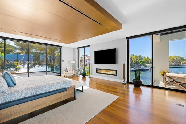 Bedroom, Fireplace, Interior, Recessed Lighting, Water, Wood Texture Flooring