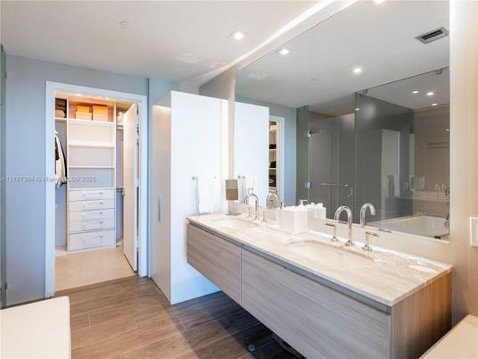 Bathroom, Dual Sink Vanities, Interior, Recessed Lighting, Walk-in Closets, Wood Texture Flooring