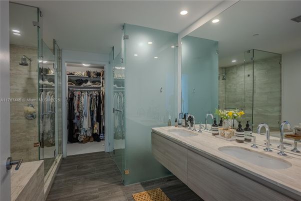 Bathroom, Dual Sink Vanities, Glass Shower, Interior, Recessed Lighting, Walk-in Closets, Wood Texture Flooring