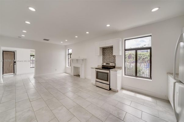 Empty room, Fireplace, Interior, Kitchen, Recessed Lighting, Stainless Steel Appliances