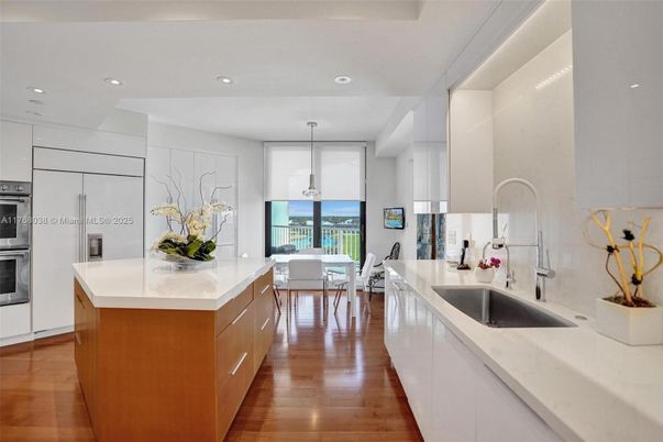 Dining room, Interior, Kitchen, Pendant Lights, Recessed Lighting, Stainless Steel Appliances, Water, Wood Texture Flooring