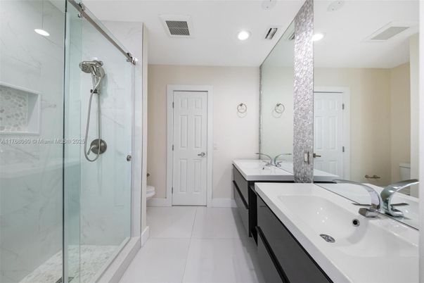 Bathroom, Dual Sink Vanities, Glass Shower, Interior, Marble Walls, Recessed Lighting