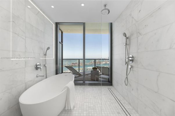 Bathroom, Free Standing Baths, Glass Shower, Interior, Marble Walls, Recessed Lighting, Water