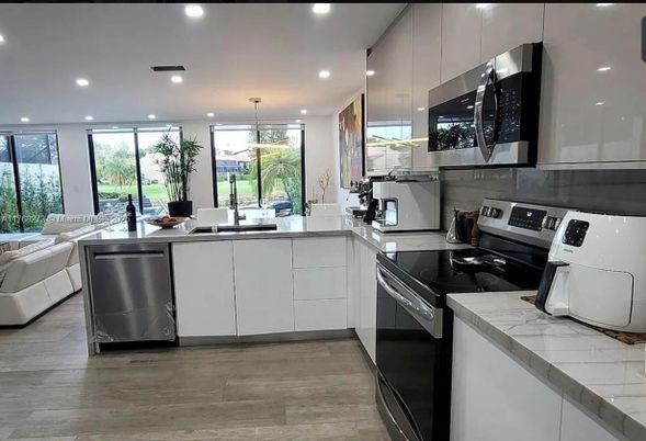 Interior, Kitchen, Pendant Lights, Recessed Lighting, Stainless Steel Appliances, Wood Texture Flooring