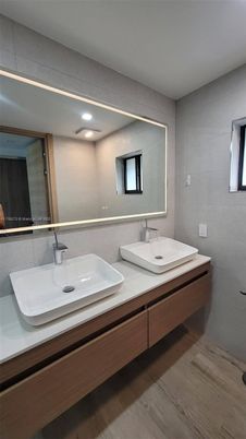 Bathroom, Dual Sink Vanities, Interior, Recessed Lighting, Wood Texture Flooring
