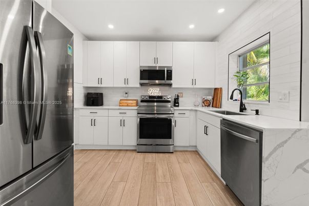 Interior, Kitchen, Recessed Lighting, Stainless Steel Appliances, Wood Texture Flooring