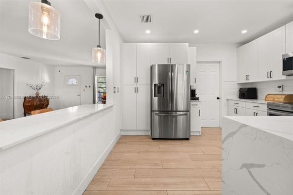 Interior, Kitchen, Pendant Lights, Recessed Lighting, Stainless Steel Appliances, Wood Texture Flooring