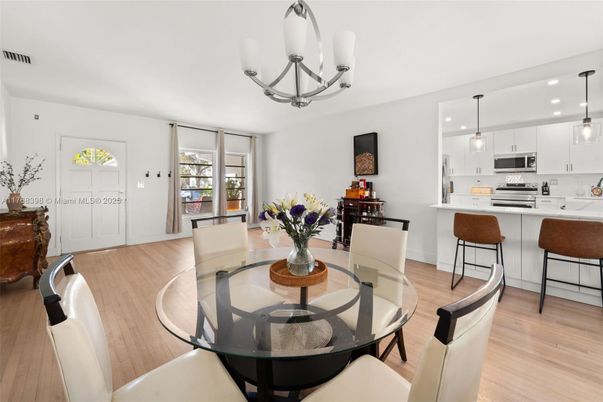 Chandelier, Dining room, Interior, Kitchen, Pendant Lights, Recessed Lighting, Stainless Steel Appliances, Wood Texture Flooring