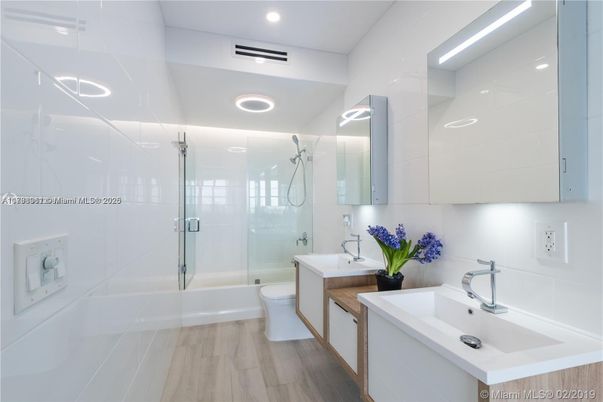 Bathroom, Dual Sink Vanities, Glass Shower, Interior, Recessed Lighting, Wood Texture Flooring