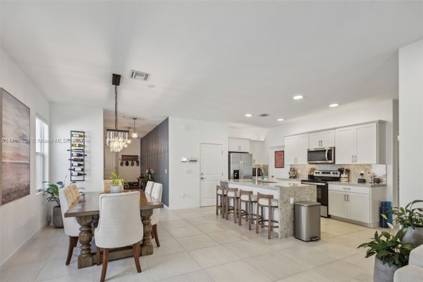 Chandelier, Dining room, Interior, Kitchen, Pendant Lights, Recessed Lighting, Stainless Steel Appliances