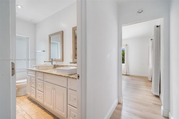 Bathroom, Dual Sink Vanities, Interior, Recessed Lighting, Wood Texture Flooring