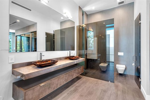 Bathroom, Dual Sink Vanities, Free Standing Baths, Glass Shower, Interior, Recessed Lighting, Wood Texture Flooring
