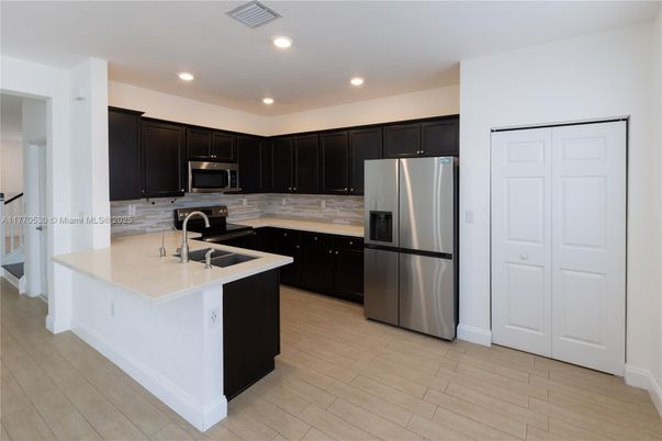Interior, Kitchen, Recessed Lighting, Stainless Steel Appliances, Wood Texture Flooring