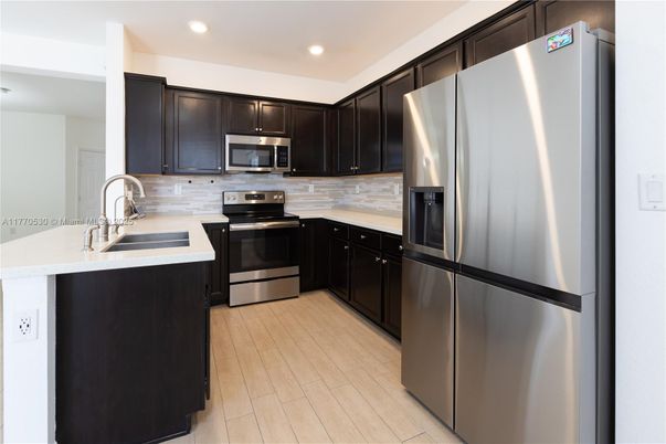 Interior, Kitchen, Recessed Lighting, Stainless Steel Appliances, Wood Texture Flooring