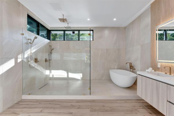 Bathroom, Free Standing Baths, Glass Shower, Interior, Recessed Lighting, Wood Texture Flooring