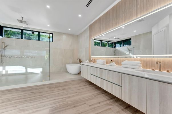 Bathroom, Dual Sink Vanities, Free Standing Baths, Glass Shower, Interior, Recessed Lighting, Wood Texture Flooring